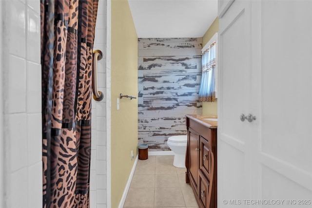 bathroom with a shower with curtain, toilet, vanity, tile patterned flooring, and wallpapered walls