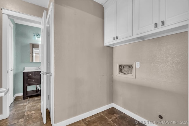 laundry area featuring cabinet space, baseboards, washer hookup, and hookup for an electric dryer