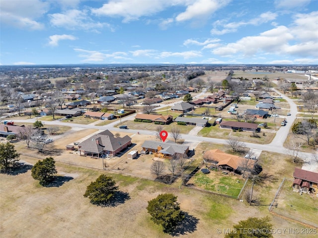 birds eye view of property with a residential view