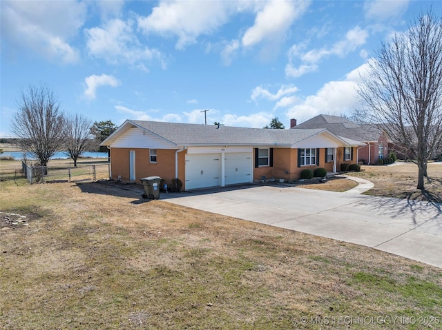 ranch-style house with driveway, an attached garage, and fence