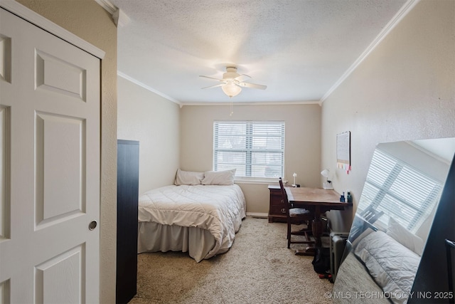 carpeted bedroom featuring a textured ceiling, a ceiling fan, and crown molding