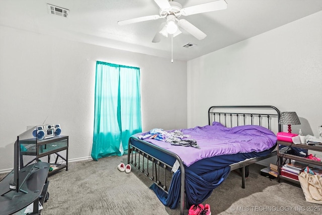 bedroom with carpet floors, visible vents, and a ceiling fan