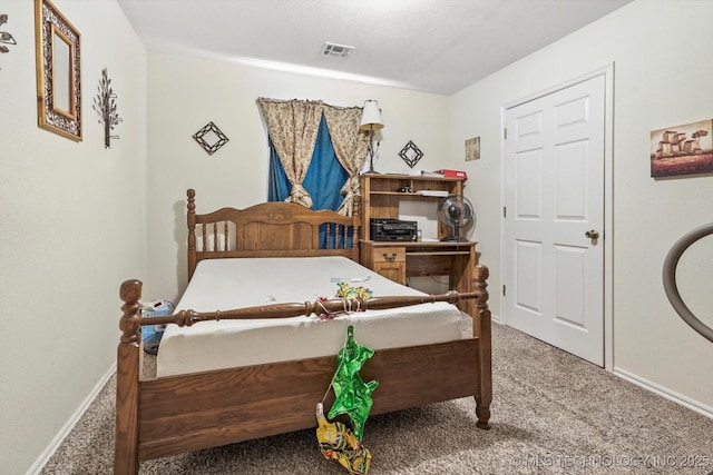 carpeted bedroom with baseboards