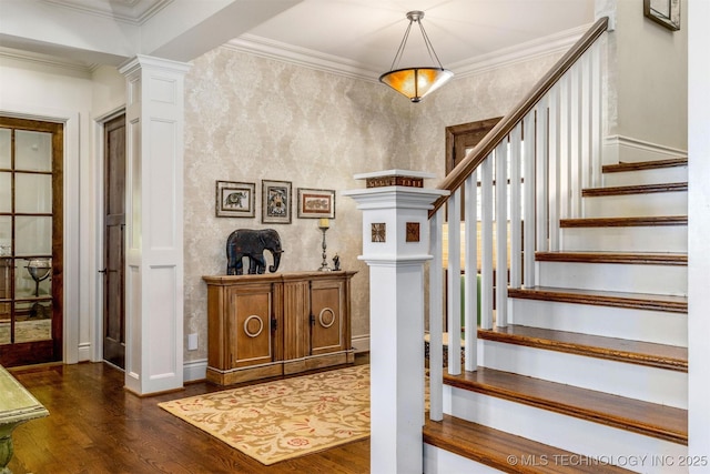 49721 E 95th Rd, Miami, OK 74354 - foyer featuring stairway, crown molding, ornate columns, and dark wood-style flooring