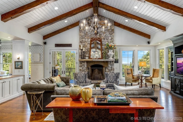49721 E 95th Rd, Miami, OK 74354 - living room featuring a fireplace, high vaulted ceiling, wood finished floors, and a chandelier