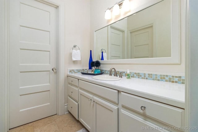 49721 E 95th Rd, Miami, OK 74354 - bathroom with tasteful backsplash, vanity, and tile patterned flooring