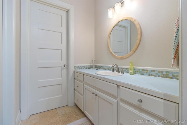 49721 E 95th Rd, Miami, OK 74354 - bathroom featuring vanity and tasteful backsplash