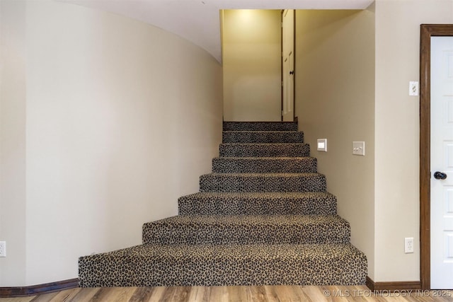 49721 E 95th Rd, Miami, OK 74354 - stairway featuring baseboards and wood finished floors