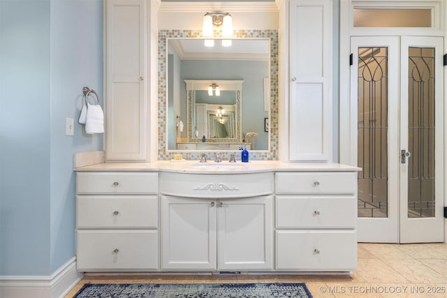 49721 E 95th Rd, Miami, OK 74354 - bathroom with vanity, crown molding, baseboards, and tile patterned floors