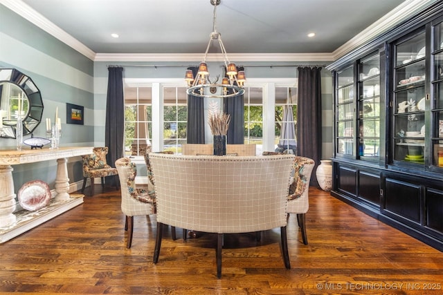 49721 E 95th Rd, Miami, OK 74354 - dining space featuring dark wood finished floors, recessed lighting, crown molding, and an inviting chandelier