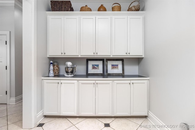 49721 E 95th Rd, Miami, OK 74354 - bar with light tile patterned floors and baseboards