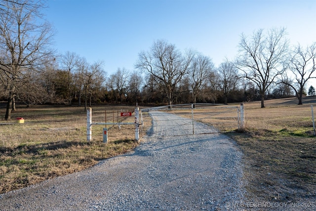 49721 E 95th Rd, Miami, OK 74354 - view of road with a gated entry, a rural view, and a gate