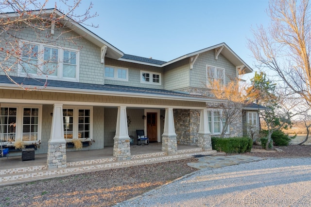 49721 E 95th Rd, Miami, OK 74354 - view of front of property with stone siding and a porch