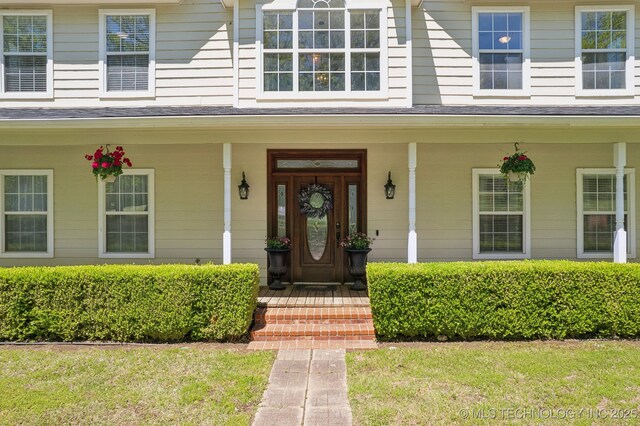entrance to property with a porch