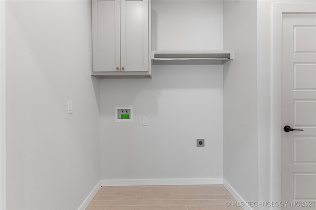 clothes washing area featuring washer hookup, cabinet space, baseboards, and electric dryer hookup