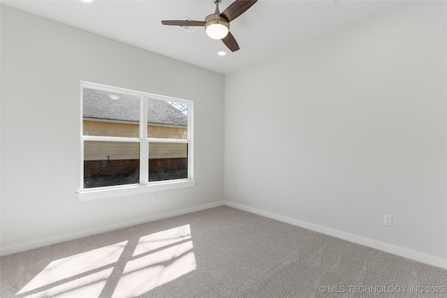 carpeted spare room with ceiling fan, baseboards, and recessed lighting