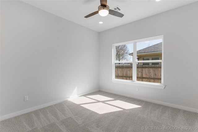 carpeted empty room with baseboards, visible vents, a ceiling fan, and recessed lighting