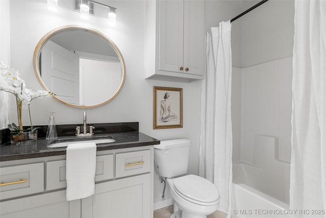 bathroom featuring shower / tub combo, vanity, and toilet