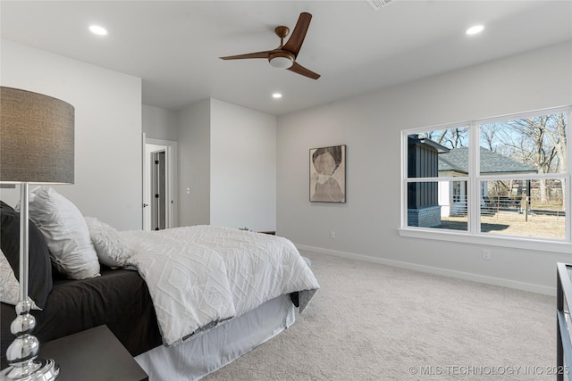 bedroom featuring light carpet, baseboards, a ceiling fan, and recessed lighting