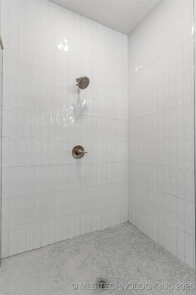 bathroom with tiled shower