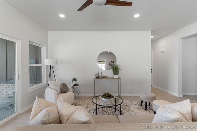 living area with ceiling fan, baseboards, and recessed lighting