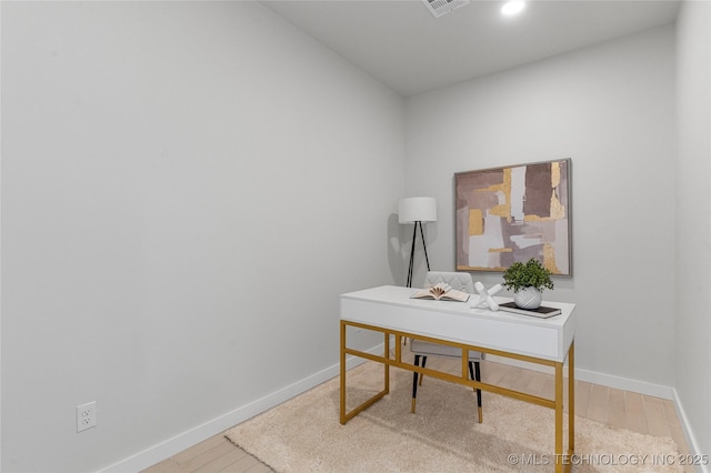 office space featuring recessed lighting, wood finished floors, visible vents, and baseboards