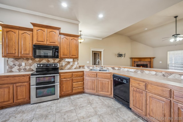 kitchen featuring brown cabinets, light countertops, a sink, and black appliances