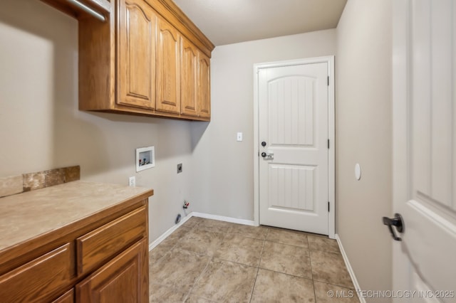 clothes washing area with light tile patterned floors, gas dryer hookup, hookup for a washing machine, hookup for an electric dryer, and cabinet space