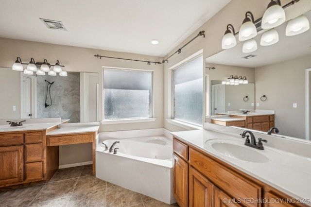 bathroom with a garden tub, visible vents, walk in shower, and a sink