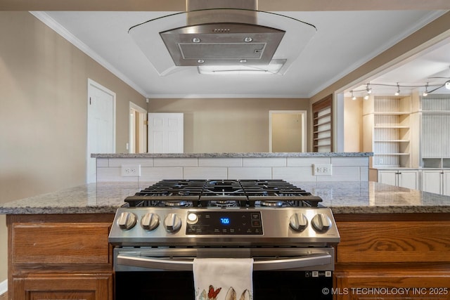 kitchen with crown molding, light stone countertops, brown cabinetry, and stainless steel gas range