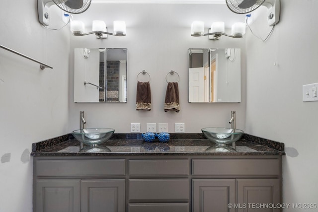 bathroom featuring double vanity and a sink