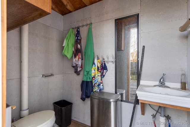 half bathroom with a sink and toilet