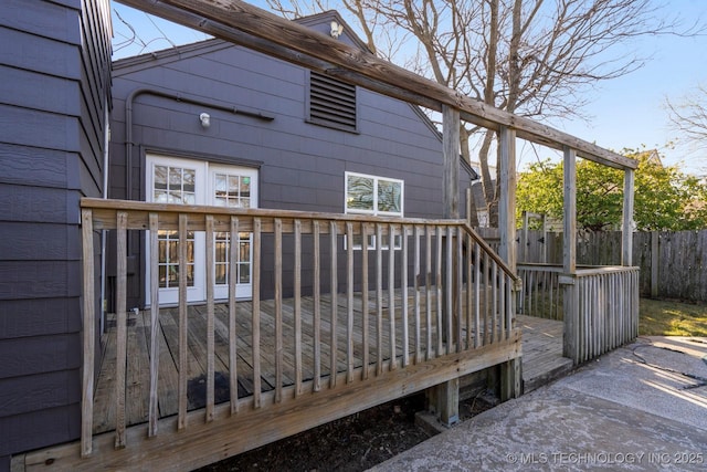 wooden deck featuring fence