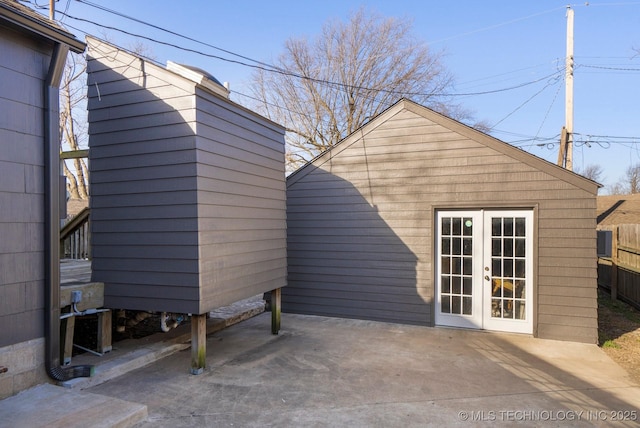 back of house with a patio area, french doors, an outdoor structure, and fence