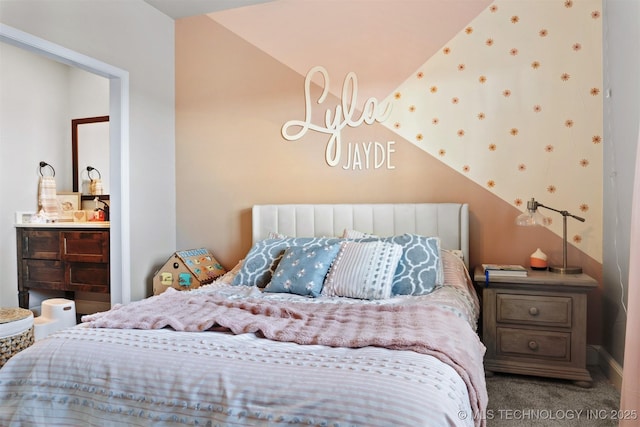 bedroom with vaulted ceiling and carpet flooring