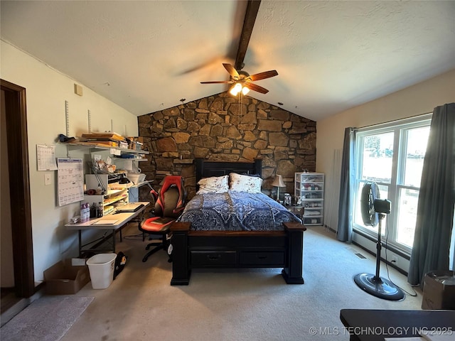 carpeted bedroom with vaulted ceiling with beams, a ceiling fan, and a textured ceiling