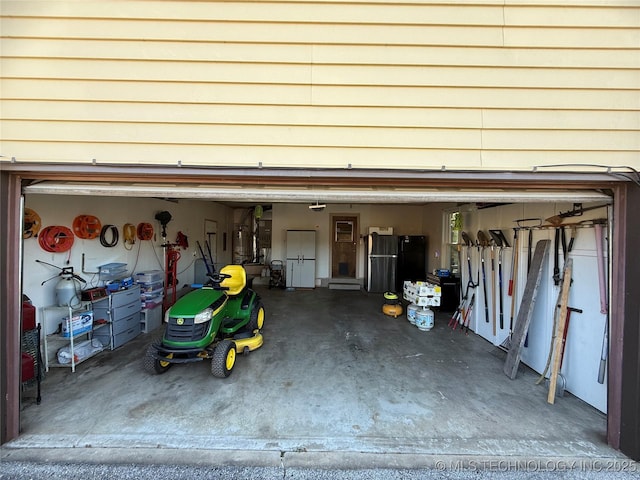 garage with freestanding refrigerator