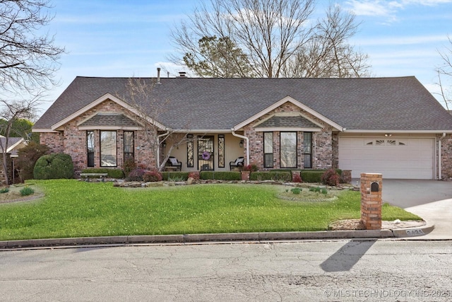 view of front facade with an attached garage, brick siding, a shingled roof, concrete driveway, and a front lawn