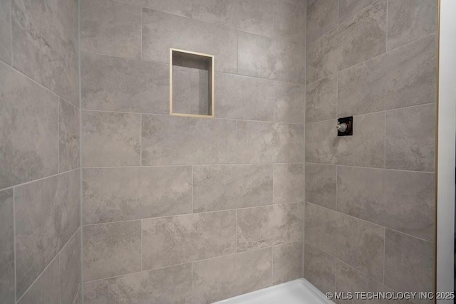 full bath featuring a tile shower