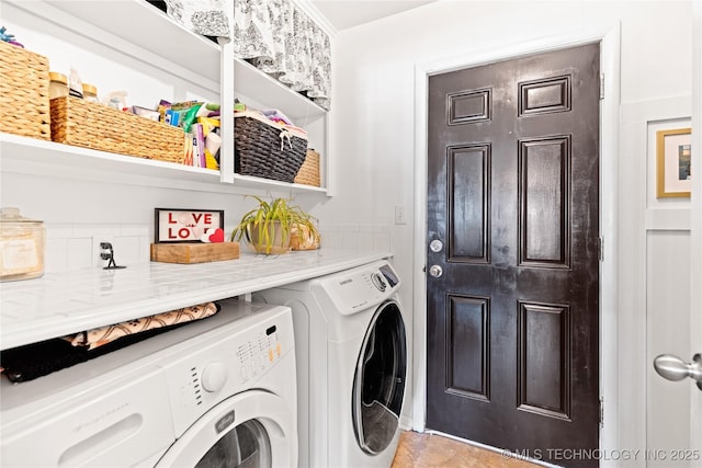 laundry area featuring washer and dryer and laundry area