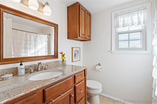 bathroom with a shower with shower curtain, toilet, tile patterned flooring, and vanity