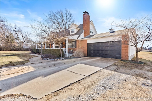 cape cod-style house featuring an attached garage, covered porch, a chimney, concrete driveway, and brick siding