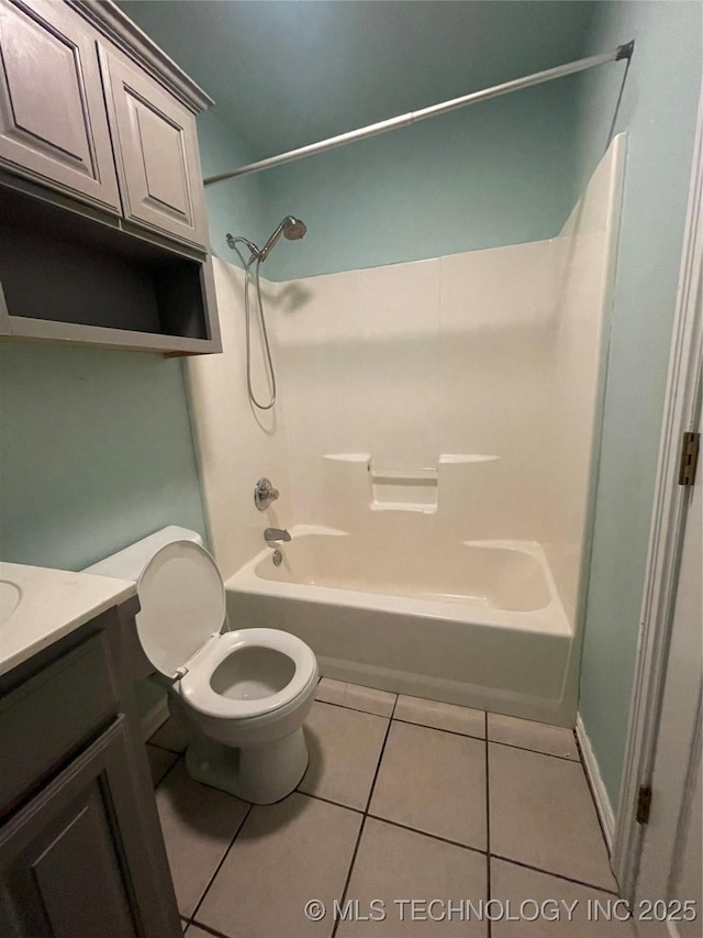 full bathroom with tile patterned flooring, toilet, vanity, and shower / bathtub combination