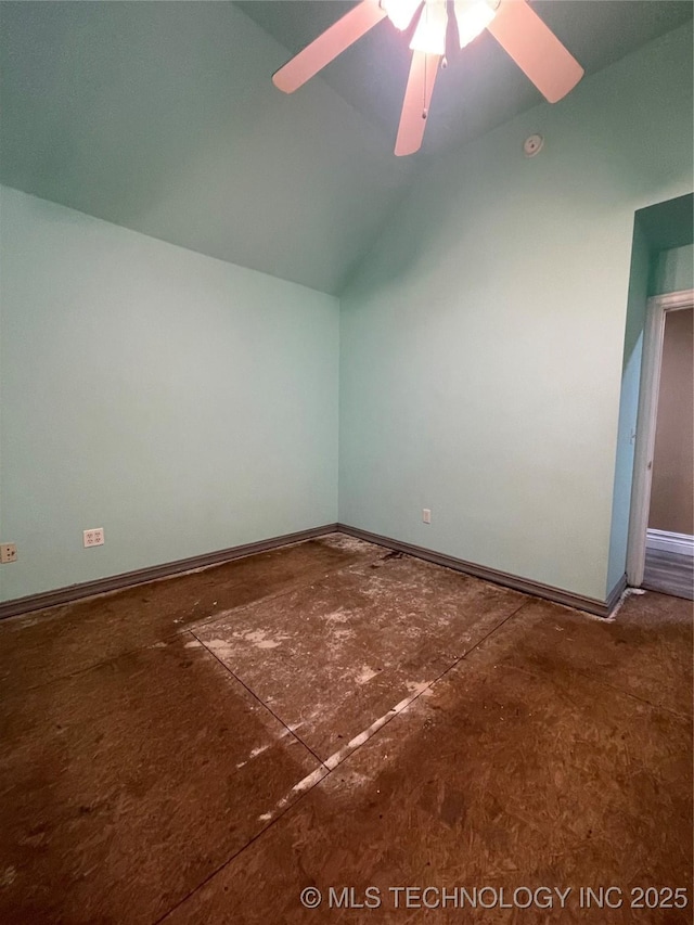 additional living space with lofted ceiling, a ceiling fan, and baseboards