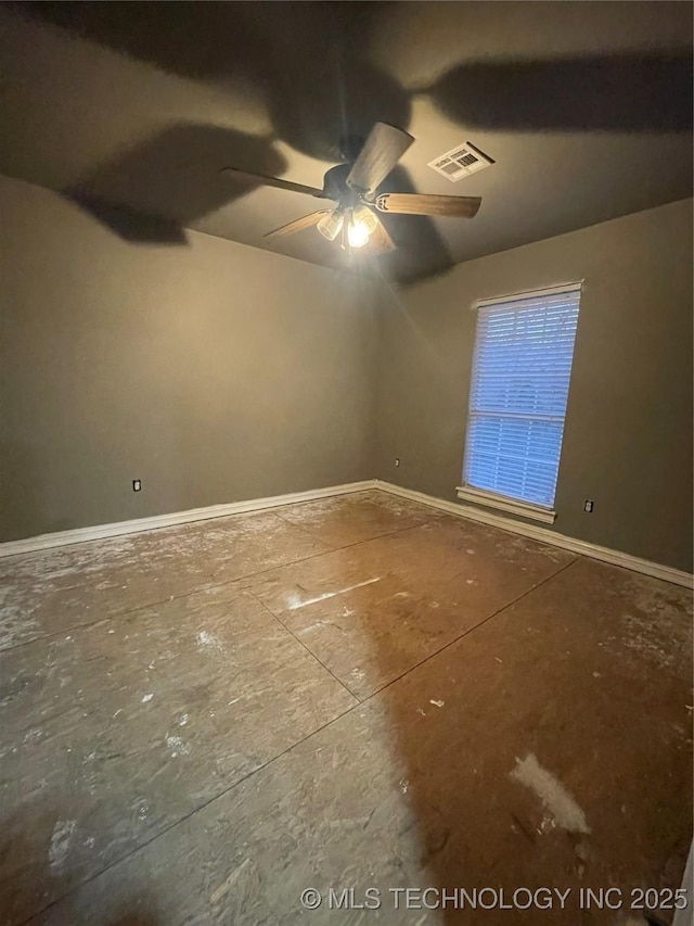 unfurnished room featuring visible vents, ceiling fan, and baseboards