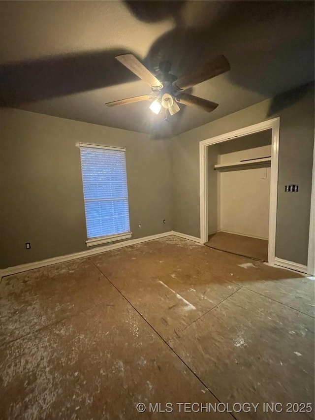 unfurnished bedroom with baseboards and a ceiling fan