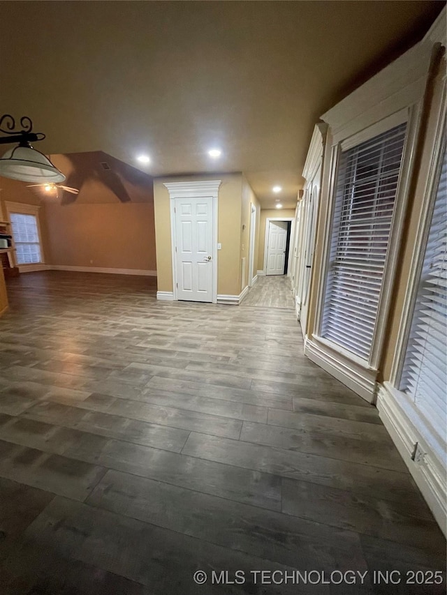 interior space with recessed lighting, baseboards, and wood finished floors