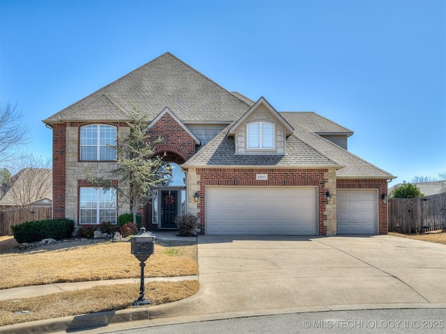 view of front of home with a garage, brick siding, fence, and roof with shingles