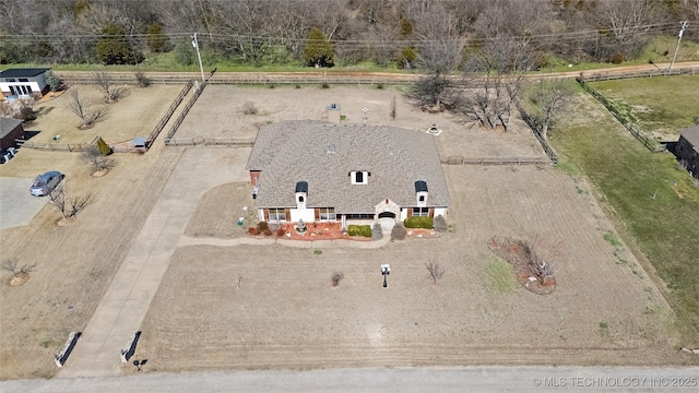 birds eye view of property with a rural view