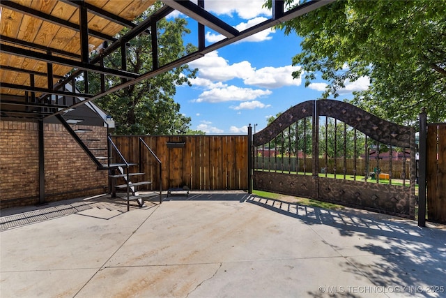 view of patio / terrace featuring a gate and fence